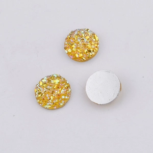 Macro shot of 10mm gold resin flatback drusy cabochons for DIY jewelry making crafts