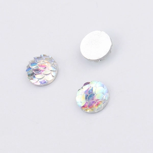 Detail of 10mm round resin scales with iridescent rainbow finish and smooth flat back