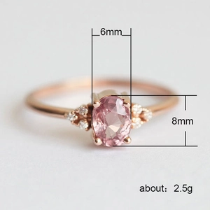 Rose gold oval pink zircon princess ring with micro-set white side stones for engagement