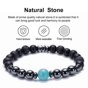 Detail of natural lava rock and tiger eye beads bracelet with a blue turquoise center