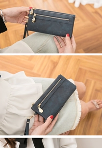 Three-view montage of a dark blue PU leather long wallet with double zippers and wristlet strap