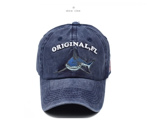 Close-up of vintage washed navy blue baseball cap with shark embroidery and USA flag detail