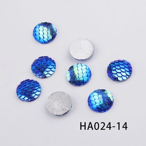 Detailed macro view of 16mm round AB colorful resin fish scale cabochons for DIY