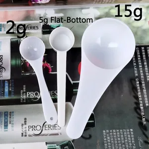 Three-piece white plastic measuring spoon set with 2g, 5g, and 15g long-handled scoops