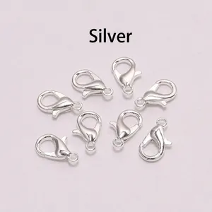 Macro shot of eight silver alloy lobster clasps for DIY jewelry making and necklaces