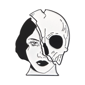 Creative split face and skull enamel pin badge on a white background for denim jackets