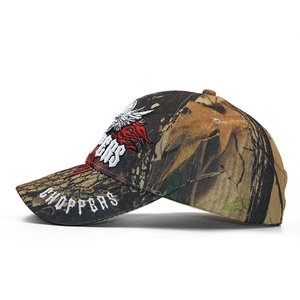 Detailed embroidery of white CHOPPERS text on a camouflage patterned baseball cap