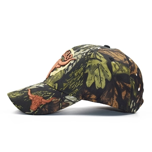 Camo baseball cap with Texas bull embroidery and classic woodland camouflage pattern