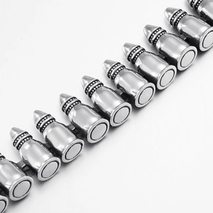 Silver punk style bullet chain accessory with polished metal texture on a grey background