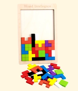Macro view of colorful wooden tetris blocks and board for educational brain development