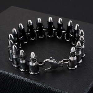 Gothic punk bullet chain bracelet for men with lobster clasp on black background