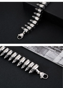 Macro view of silver punk bullet link bracelet with stainless steel texture and clasp