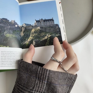 Minimalist irregular 925 silver ring featuring a smooth polished geometric texture