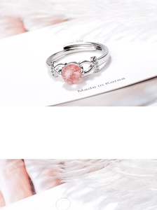 Macro detail of adjustable silver ring with pink strawberry quartz and pavé accents