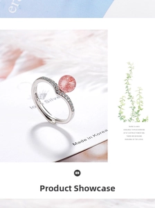 Macro shot of V-shaped silver ring featuring a pink strawberry quartz crystal sphere
