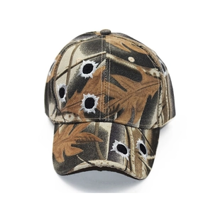 Close-up of camouflage baseball cap featuring 3D bullet hole embroidery and durable canvas