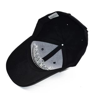 Detail of internal structure and 100% acrylic stitching on the black baseball cap