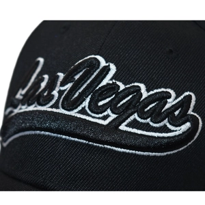 Detailed close-up of Las Vegas 3D embroidery on a black cotton twill baseball cap