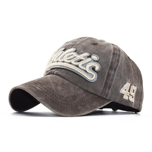 Macro detail of vintage washed cotton fabric and high-quality Athletic embroidery on cap