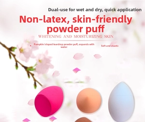 Detailed view of various soft makeup sponges in peach, skin tone and light blue colors