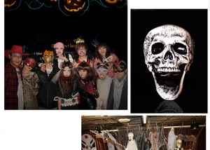 Macro view of realistic vintage skull head and assorted Halloween party decor accessories