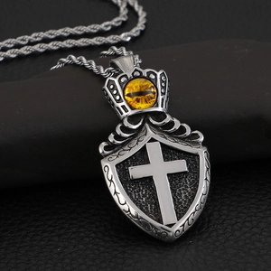 Vintage silver shield pendant with cross relief and yellow cat eye stone on rope chain