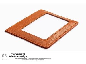 Detailed view of brown lychee grain leather wallet with a clear ID window and fine stitching