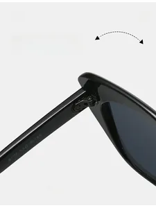 Detail view of durable metal hinges and model specs on black acetate sunglasses