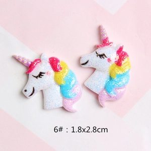 Close-up of glittery resin unicorn charm with rainbow mane for DIY accessories 1.8x2.8cm