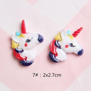 Macro detail of a 2x2.7cm glitter resin unicorn charm for DIY hair clips and shoes