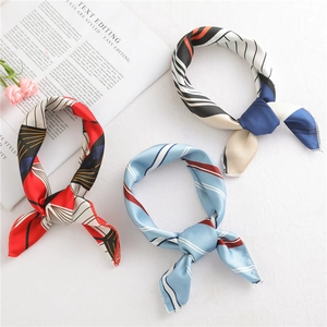 Three elegant satin square scarves with red print and blue stripes on a white background