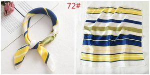 Detail of navy and yellow striped satin square scarf with elegant French style styling