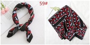 Detail view of 50cm leopard print satin silk scarf in red and blue with black borders