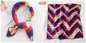 Detailed view of square silk scarf with red and blue stripes and pattern model 46