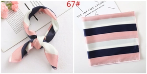 Detail of pink and navy striped silk-like satin square scarf with rolled edges