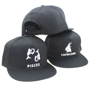 Three black flat-brim hip-hop caps with glowing Pisces and Capricorn zodiac graphics