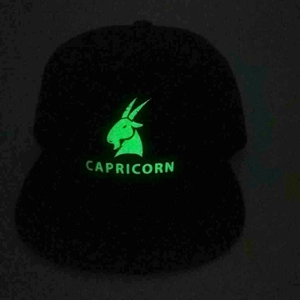 Glow-in-the-dark Capricorn goat symbol detail on black flat brim hip-hop baseball cap