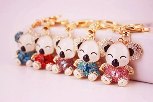 Detail view of colorful koala keychains with sparkling rhinestones and gold rings