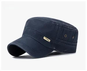 Detail view of washed cotton cadet cap with vintage bronze metal logo and eyelets