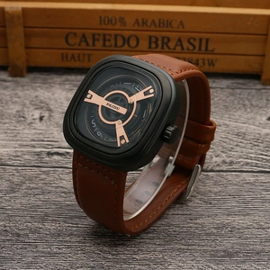 Detail of square quartz watch featuring a black case, brown leather strap and rotating dial