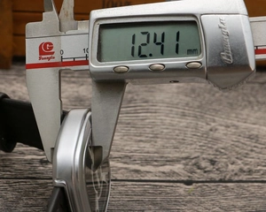 Detail view measuring 12.41mm case thickness of this punk square dial quartz watch