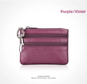 Violet pebble grain leather mini coin purse featuring three-zipper pockets and silver keychain