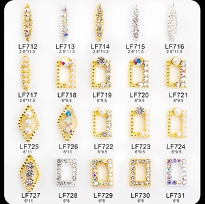 Macro shot of 20 assorted alloy nail charms with pearls and colorful rhinestones