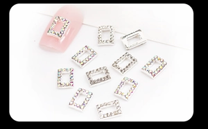 Detail of silver alloy nail charms with AB rhinestones and crystals for DIY manicure art