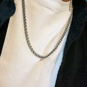 Minimalist silver keel chain necklace for men in hip hop style on model neck