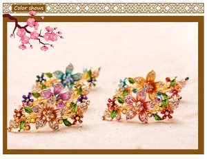 Detail of vintage hand-painted floral hair clips with sparkling rhinestones and alloy finish