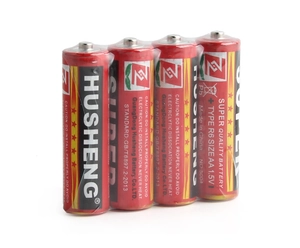 Close-up of a 4-pack 1.5V AA R6 dry cell batteries in transparent shrink-wrap packaging