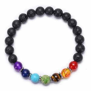 Detailed view of chakra lava rock bracelet with 8mm natural stones and metal spacers