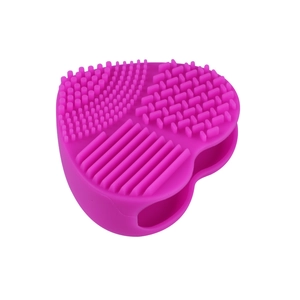 Heart-shaped silicone makeup brush cleaning mat in vibrant rose purple with multiple textures