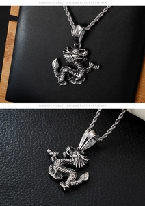 Macro detail of retro punk dragon pendant with intricate silver-gray scales and steel chain